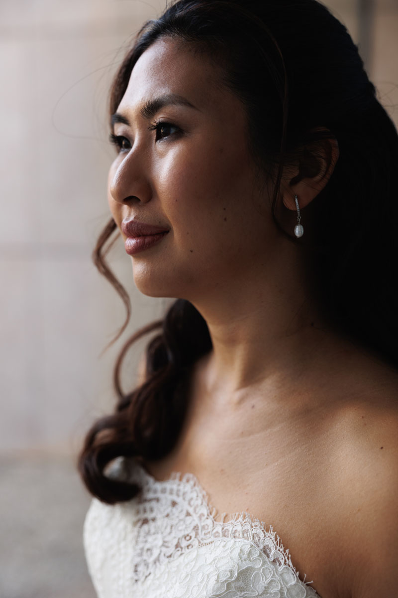 A bride, moody window lighting