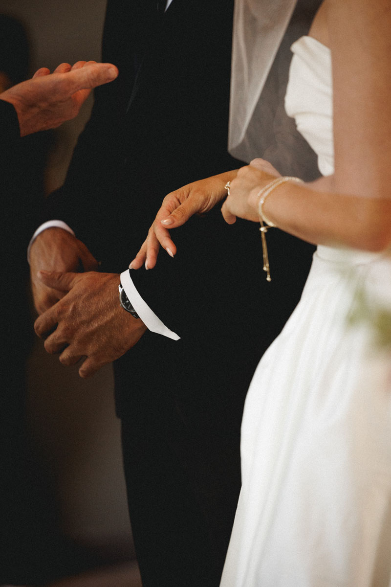 Hands of a bride and groom