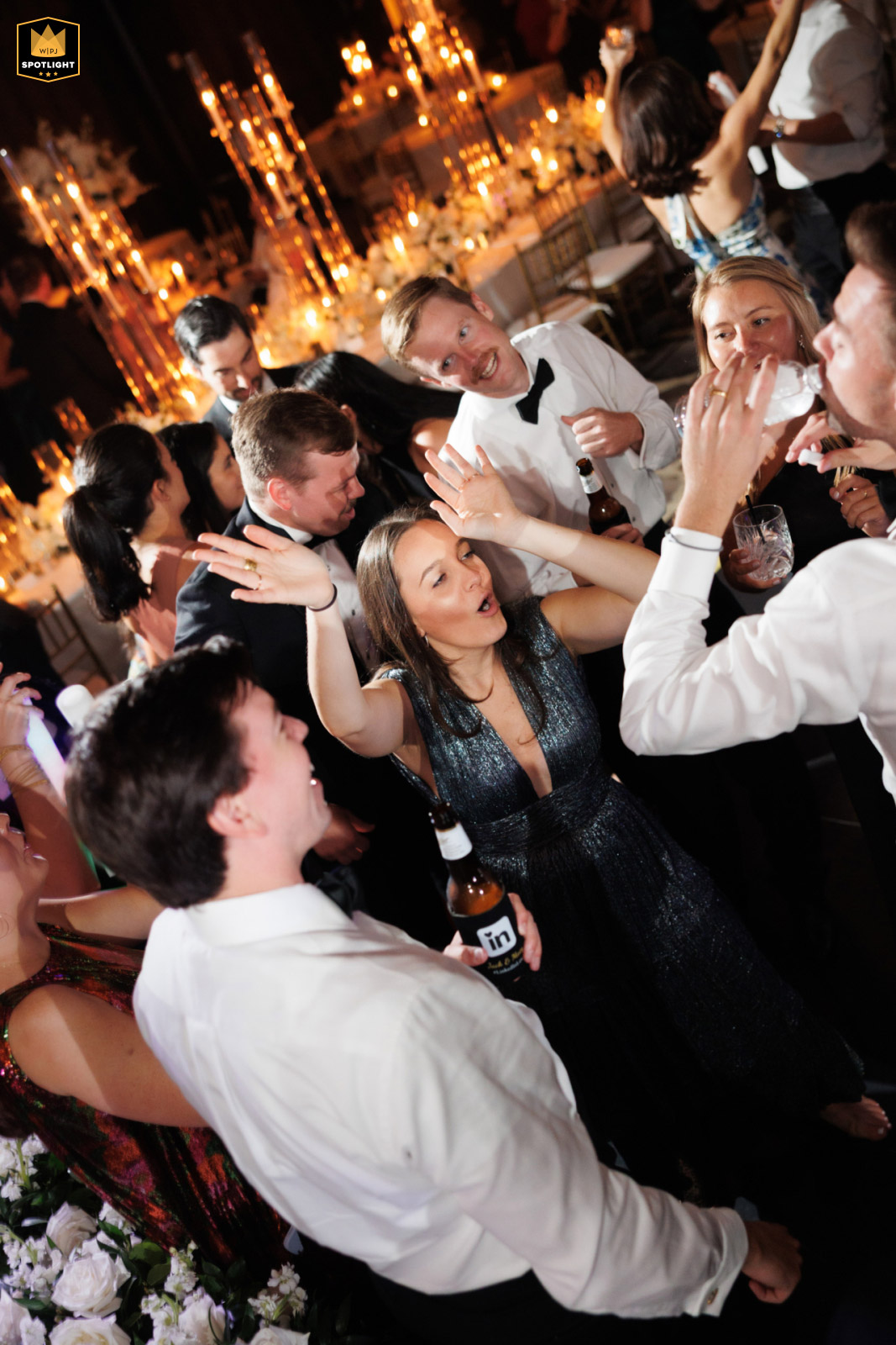 Guests dance at a wedding reception at Poak Oak Houston