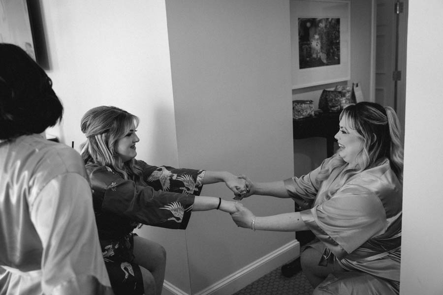 The bride has fun with her bridesmaids