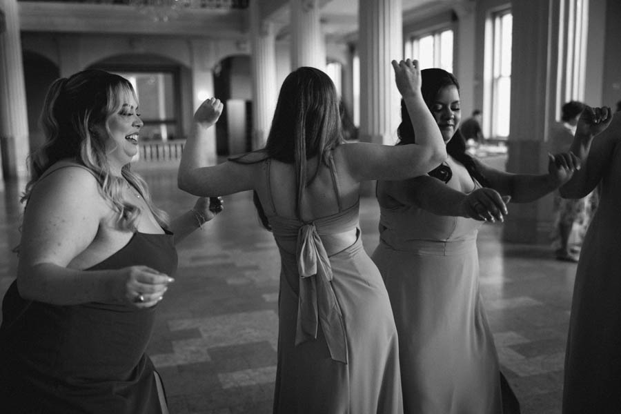 Bridesmaids dance before the ceremony