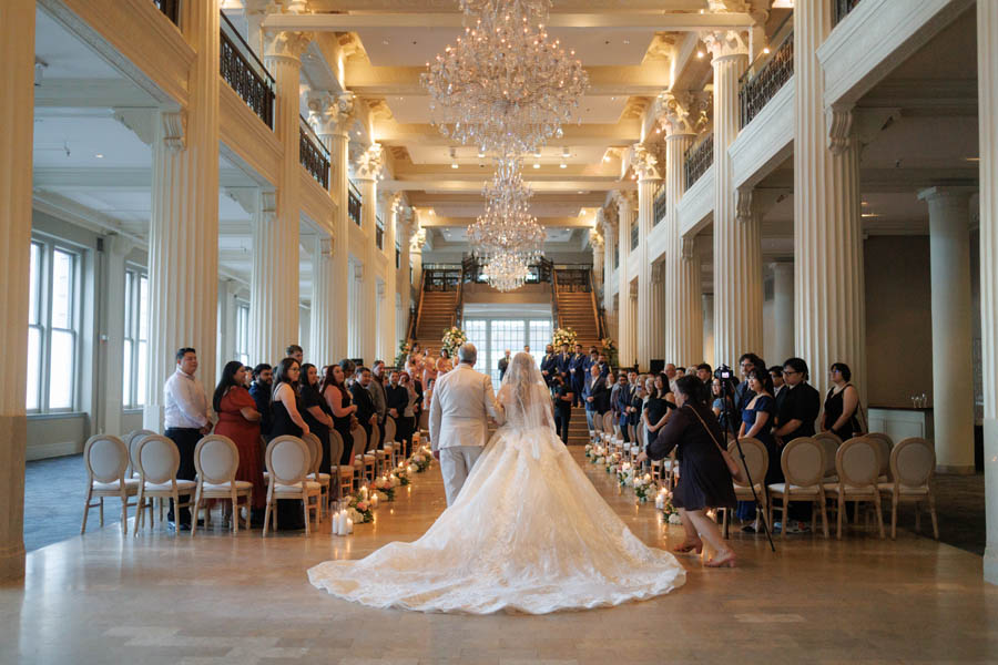 Bride and her father walk the aisle