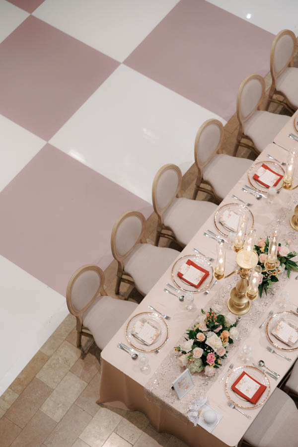 Table setup and custom dancefloor at the Corinthian