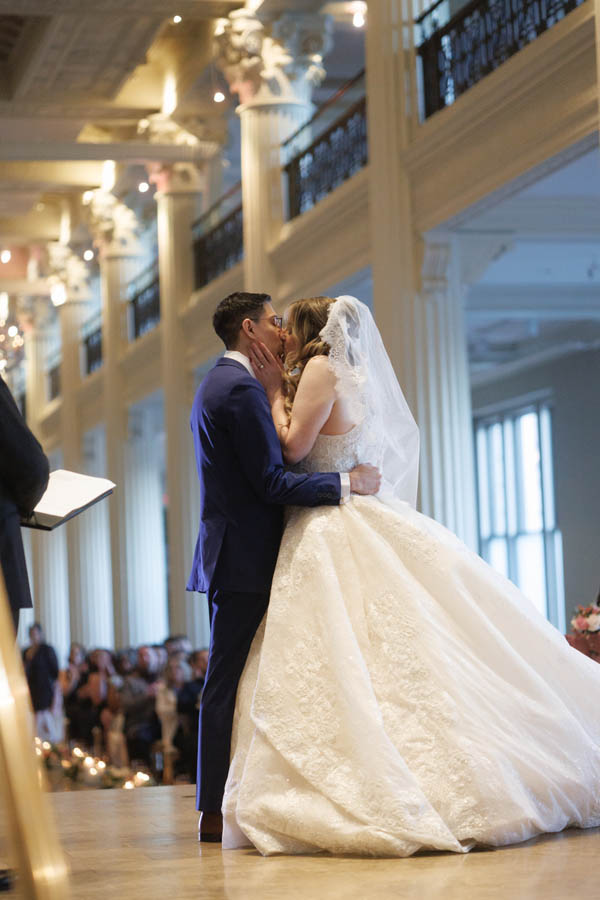 Bride and groom first kiss