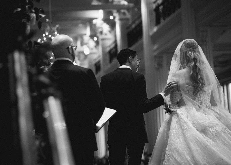 The groom reached out to his bride at the Corinthian