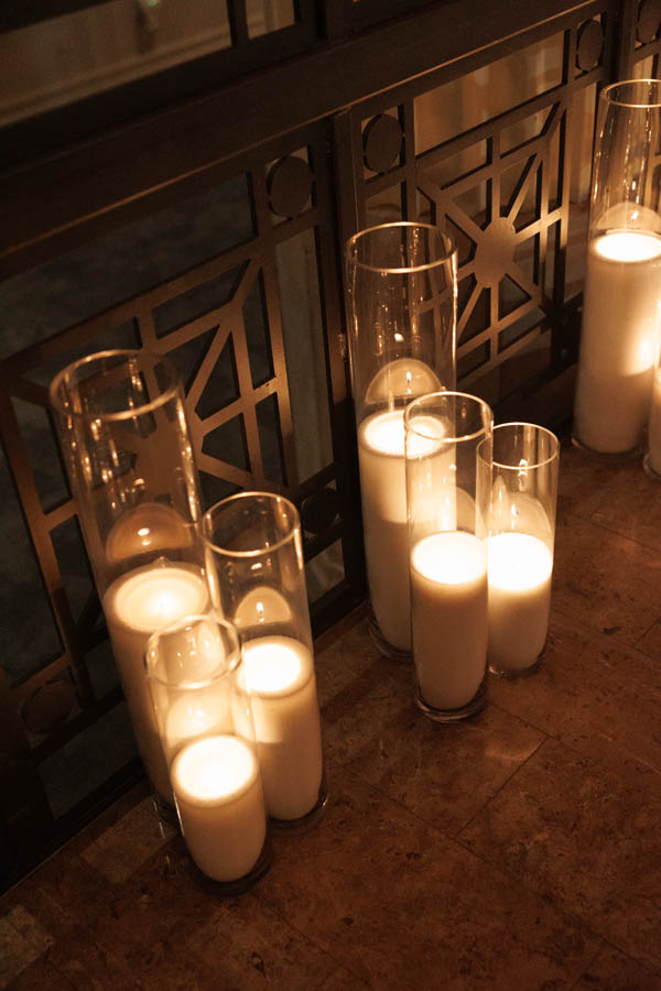 Candles light the space