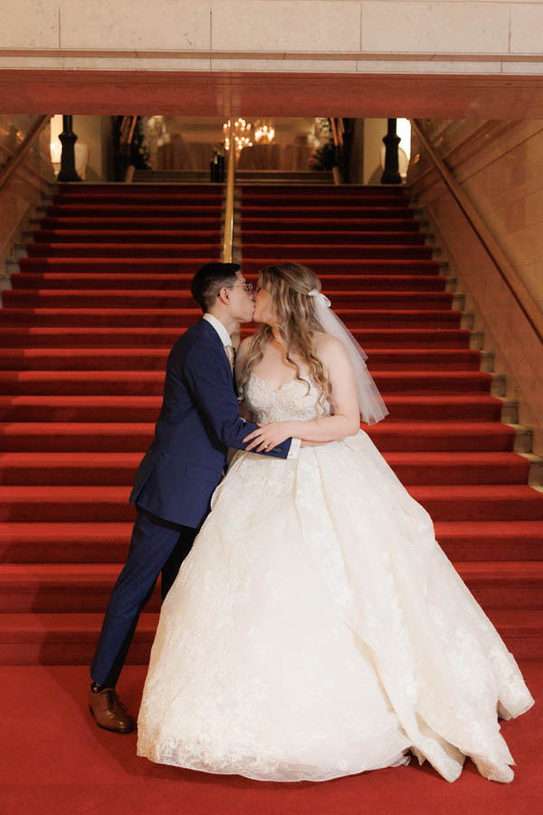 The bride and groom kiss