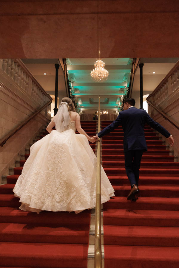 Bride and groom ascend the Corinthian staircase