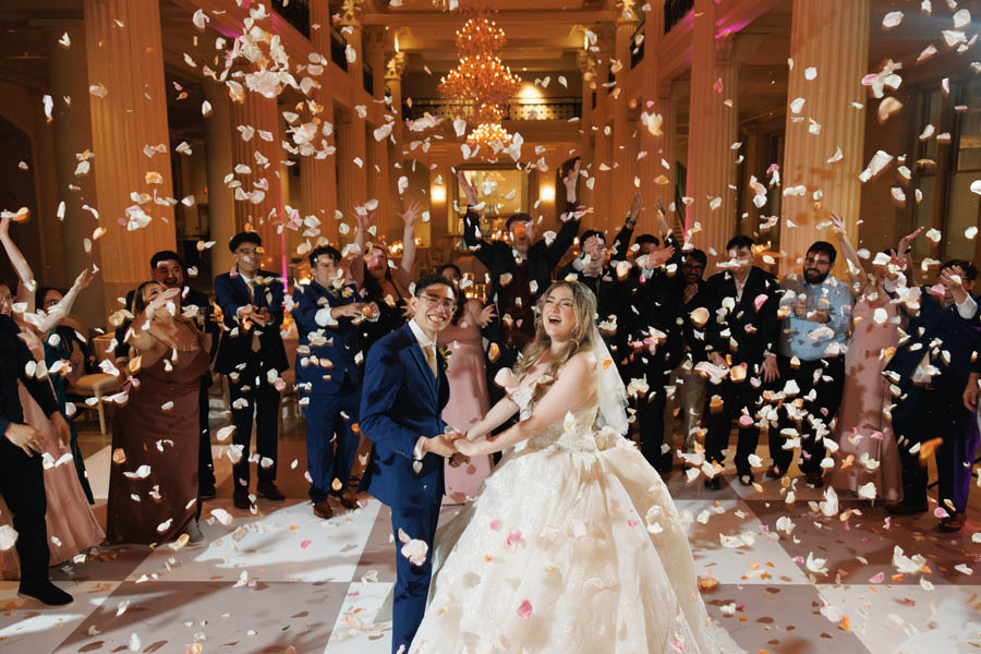 Bride and groom petal shower send off after their wedding at Houston's Corinthian