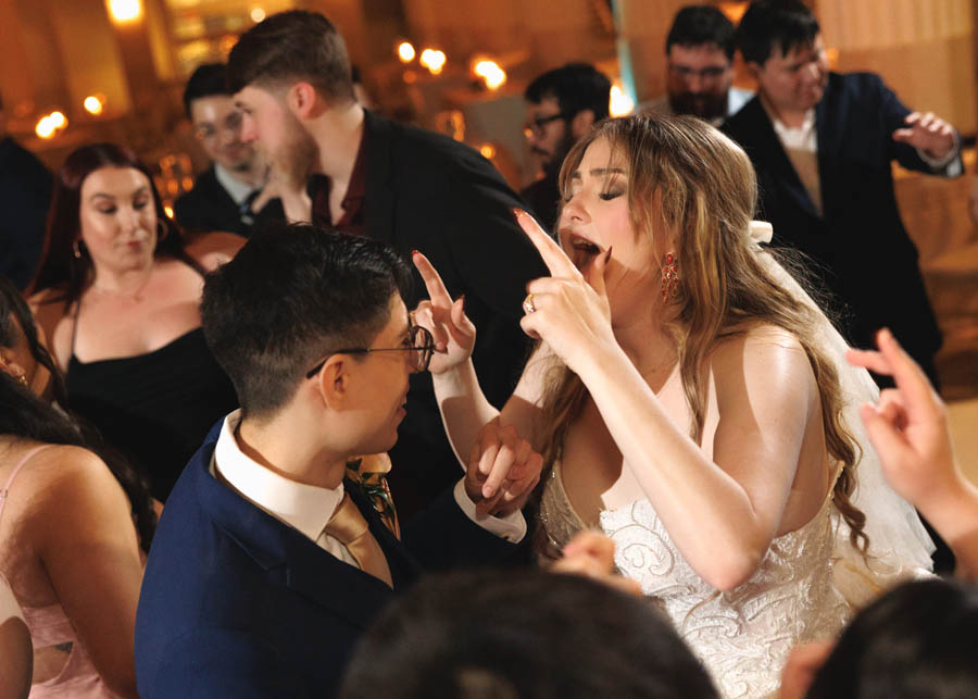 The bride dances with the groom