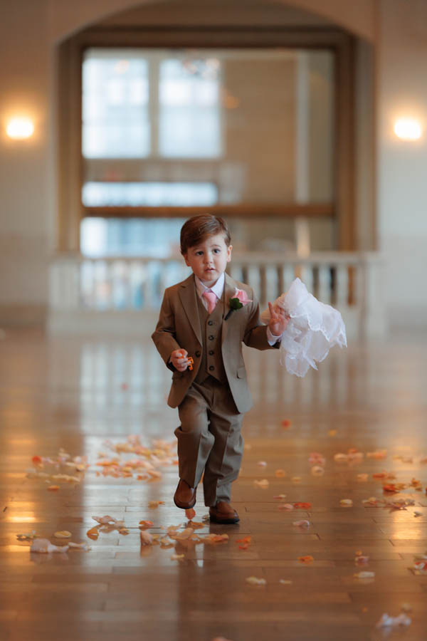 The ringbearer walks the aisle