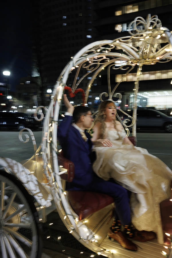 The horsedrawn carriage takes the bride and groom away