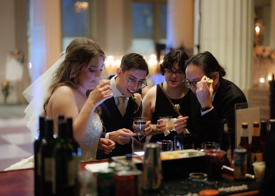 Bride, groom and friends at the bar