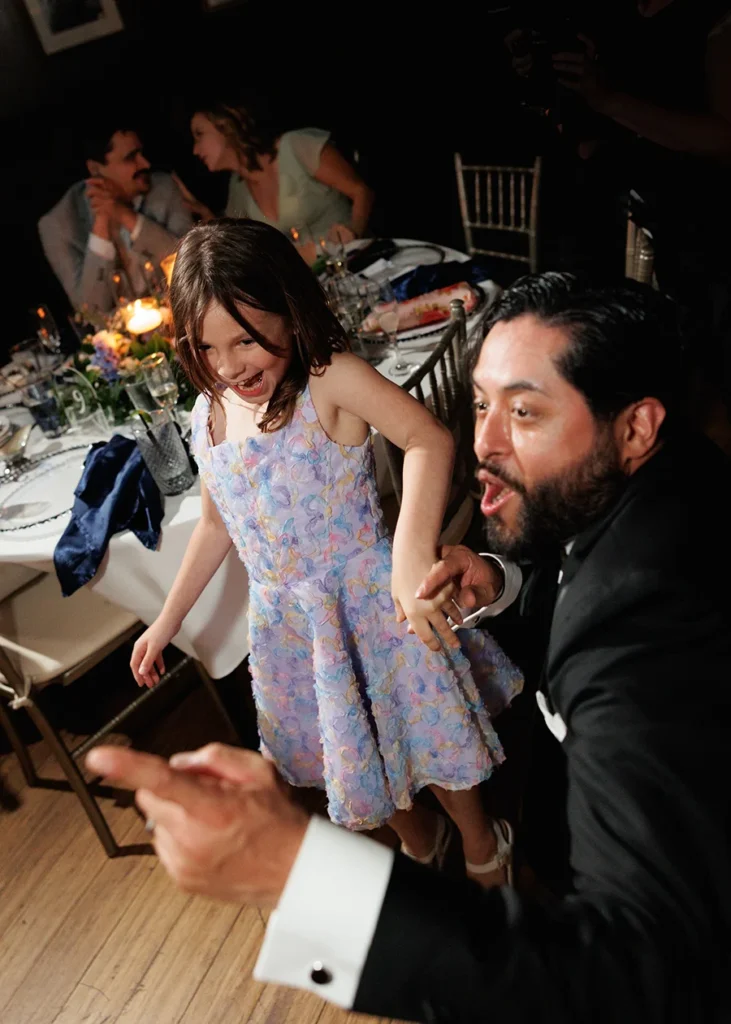 A candid moment of joy at a wedding reception