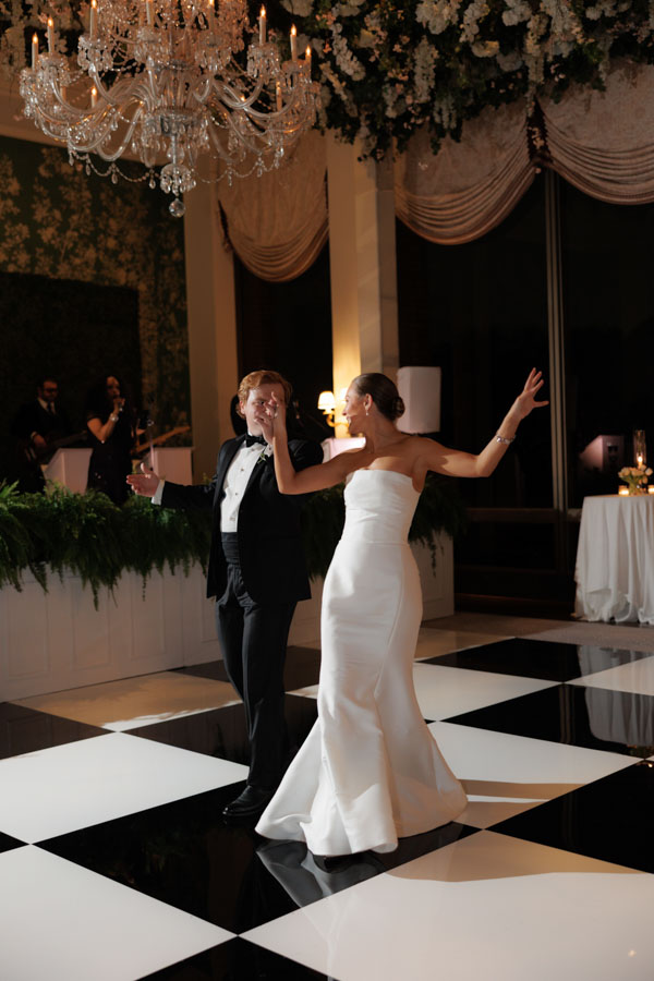 The bride and groom dance as the Jordan Kahn Orchestra plays at River Oaks Country Club