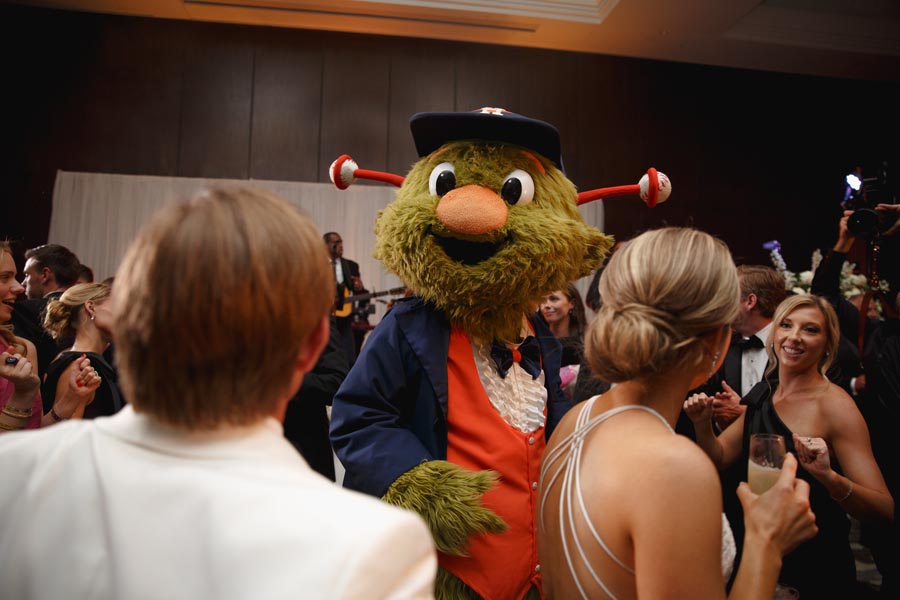 Astros mascot Orbit joins guests on the dancefloor at a Post Oak Hotel Houston black tie ballroom wedding