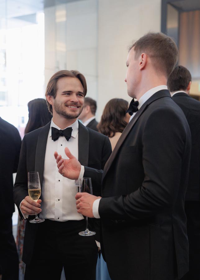 Guests chat a black tie Post Oak Houston wedding