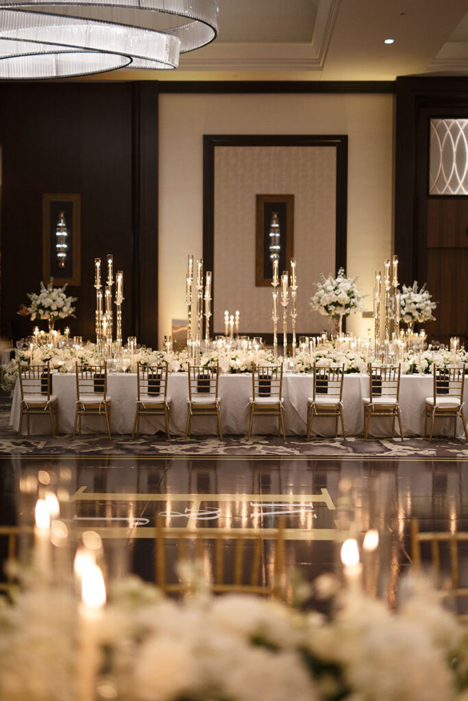Post Oak Hotel Wedding Photography - a beautiful ballroom design at Post Oak Houston, with long tables, florals and candles