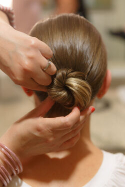 The bride's hair is styled