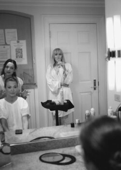 Mom watches the bride get ready