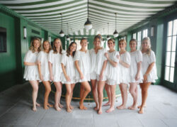 Bride and bridesmaids portrait in the bar at River Oaks Country Club