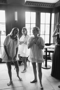 Bridesmaids laugh on the morning of the wedding in River Oaks