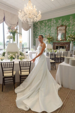 A bride looks radiant with swooping dress at River Oaks Country Club in Houston, Texas