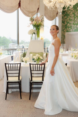 A bride views the beautiful luxury wedding design at River Oaks Country Club