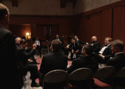 Groom, groomsmen and family of the groom wait for the wedding ceremony at Church of St. John the Divine in River Oaks