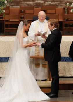 Rings are exchanged at a wedding at The Church of St. John the Divine, River Oaks