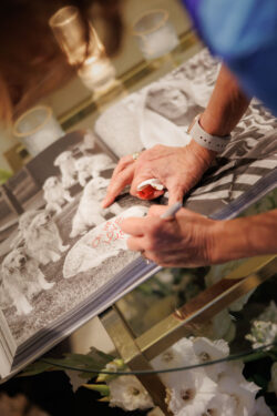 A guest signs the guest book at a luxury Texas wedding
