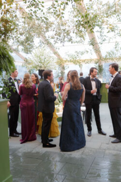 Guests mingle at the country club reception