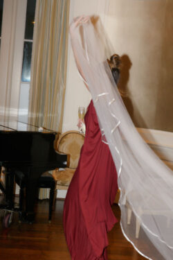 Guest carries the bride's veil