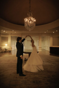 The bride and groom dance