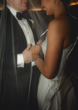 The couple hold hands