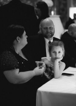 A young guest with family at dinner