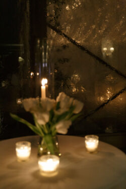 Late night table details with rain outside the tent