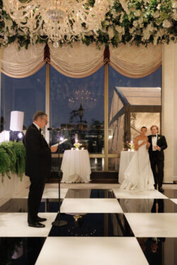 Bride and groom listen to speeches