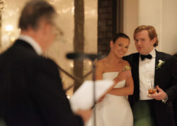 The bride smiles at her father's speech