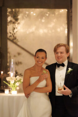 A River Oaks Country Club bride and groom listen to toasts