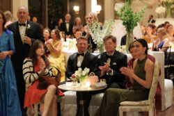 Guests applaud the toasts