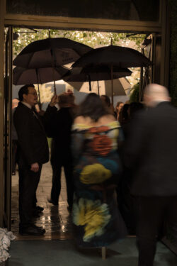 Guests hurry through rain for dinner