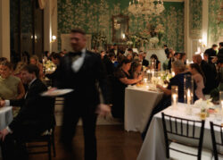 Guests begin to be seated for dinner