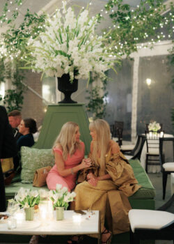 Guests deep in conversation on custom wedding furniture
