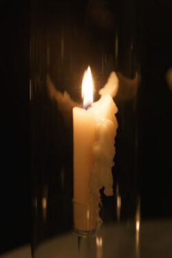 A candle burns as the reception goes on