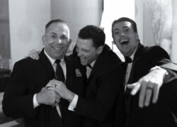Guests laugh together at the reception