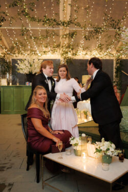 A handshake in the tented country club reception