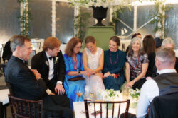Family and friends view the bride's ring