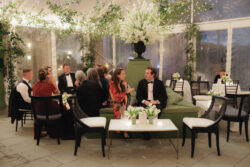 Guests chat on custom designed furniture for this luxury wedding