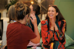 Guests laugh together at a River Oaks Country Club wedding reception